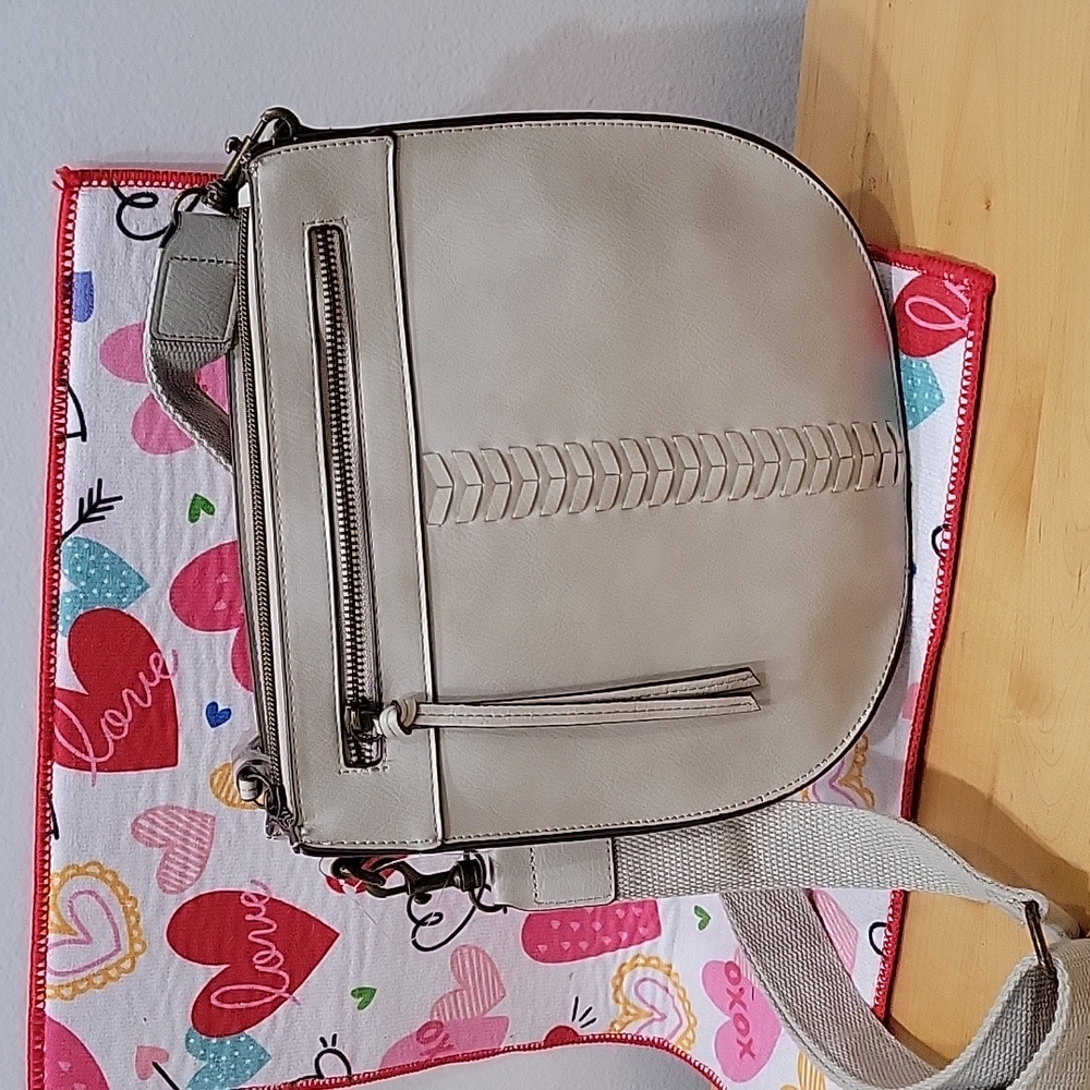 Nice sized cross body or over shoulder purse in cream color